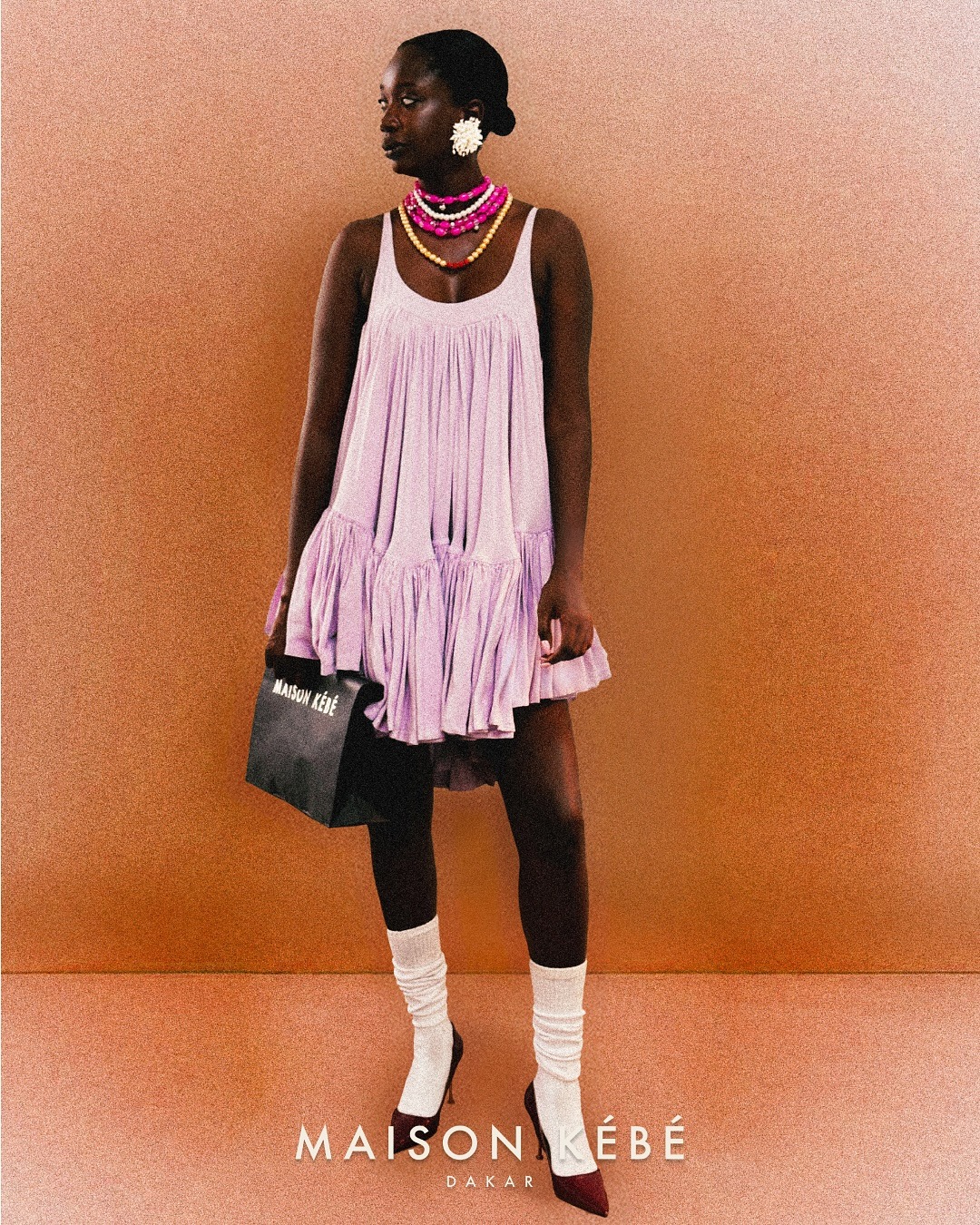 Robe lilas plissée — campagne Dakar